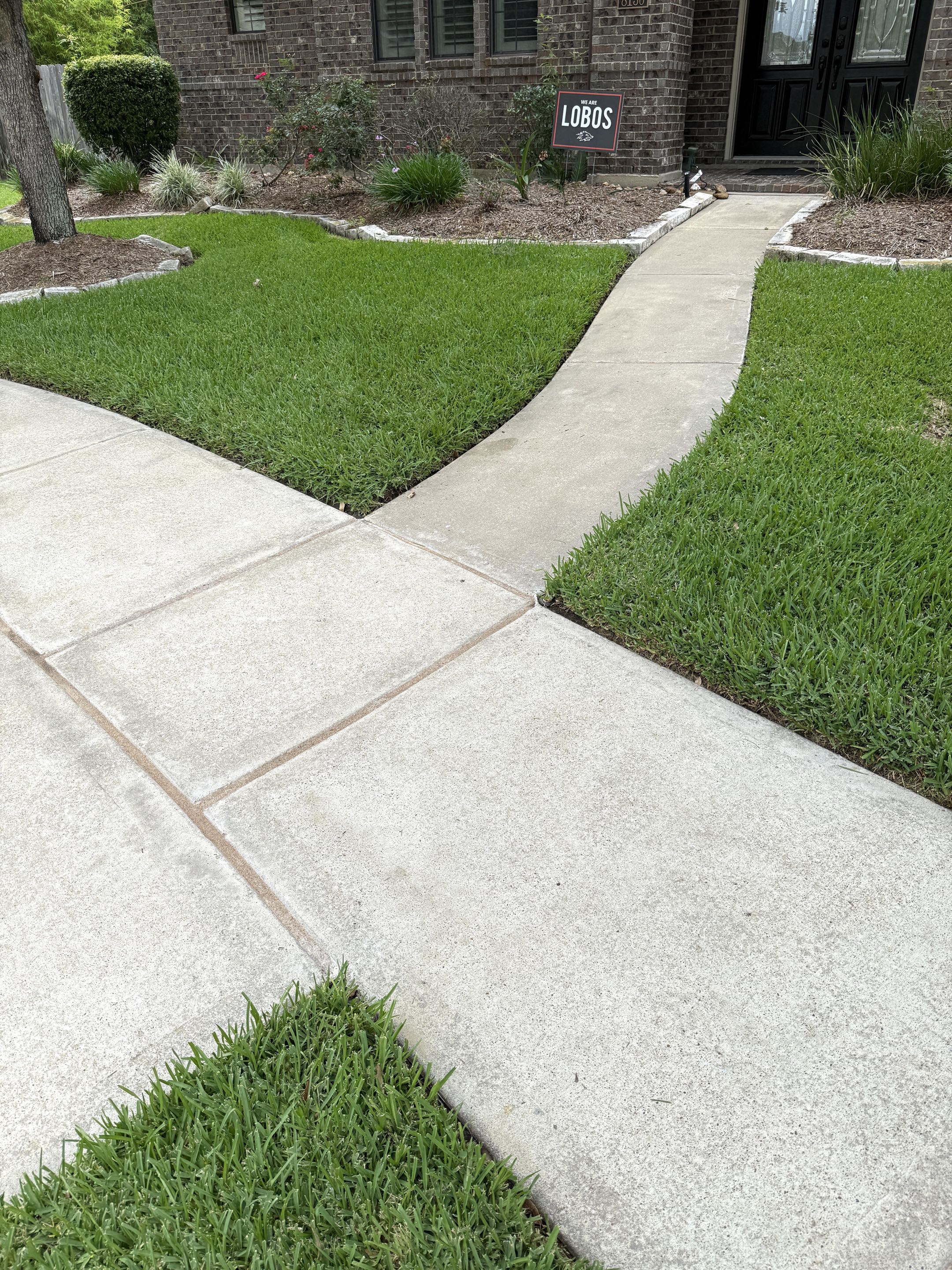 Freshly pressure-washed driveway in Cypress, TX